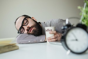 overworked content marketer with coffee