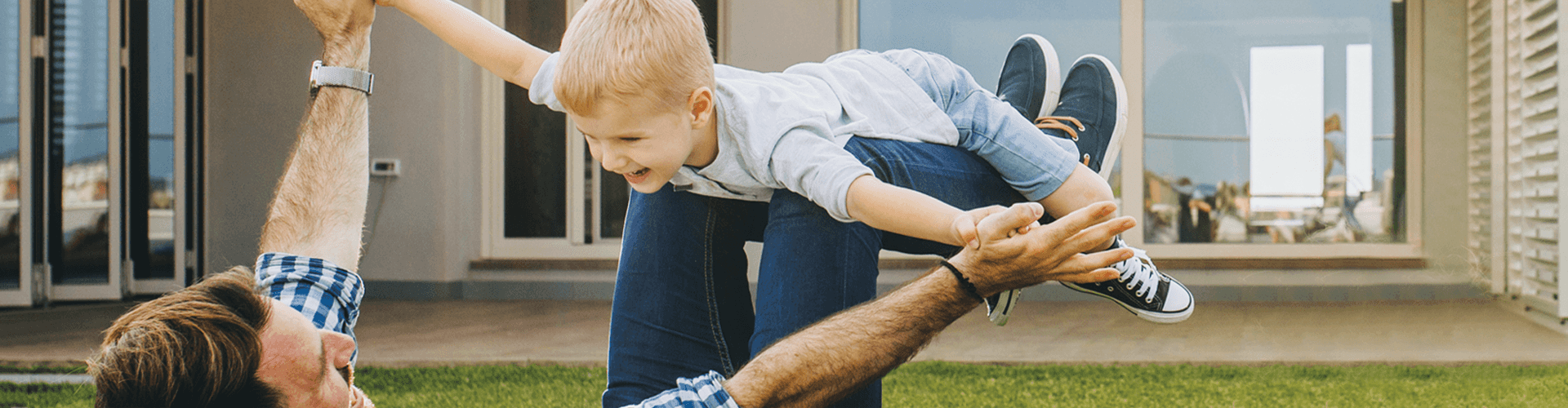 Father and son playing in the backyard