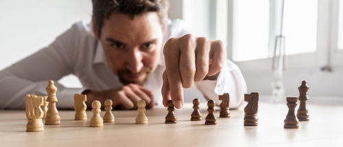 man playing chess with strategy