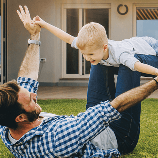 Father and son playing in the backyard